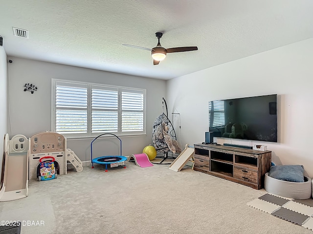 200 Azure Mist Way, Daytona Beach, FL 32124 - recreation room featuring a ceiling fan, carpet, baseboards, and a textured ceiling
