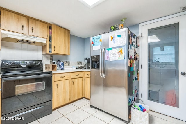 3304 India Palm Dr, Edgewater, FL 32141 - kitchen with black electric range, stainless steel refrigerator with ice dispenser, under cabinet range hood, light countertops, and light tile patterned floors