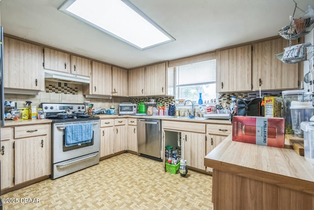 3304 India Palm Dr, Edgewater, FL 32141 - kitchen with stainless steel appliances, light countertops, and decorative backsplash