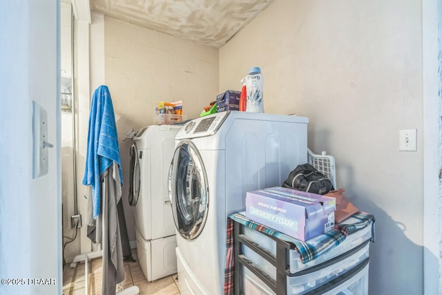 3304 India Palm Dr, Edgewater, FL 32141 - laundry area with separate washer and dryer, concrete block wall, and light tile patterned floors