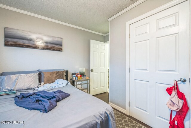 3304 India Palm Dr, Edgewater, FL 32141 - bedroom with a textured ceiling and crown molding