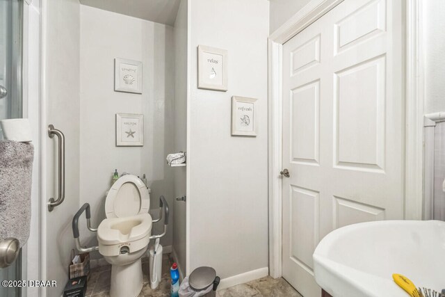 3304 India Palm Dr, Edgewater, FL 32141 - bathroom featuring toilet and baseboards
