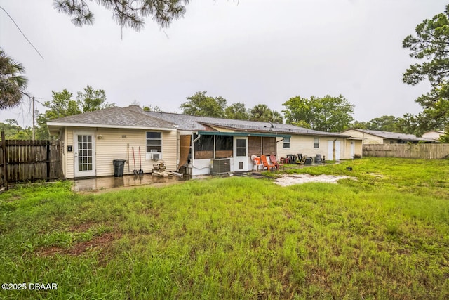3304 India Palm Dr, Edgewater, FL 32141 - rear view of house with a patio, a sunroom, a fenced backyard, and cooling unit