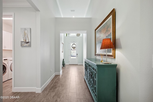 foyer featuring washer and dryer and light wood-type flooring