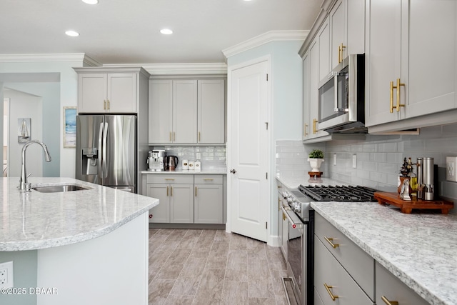 kitchen with gray cabinets, appliances with stainless steel finishes, and sink