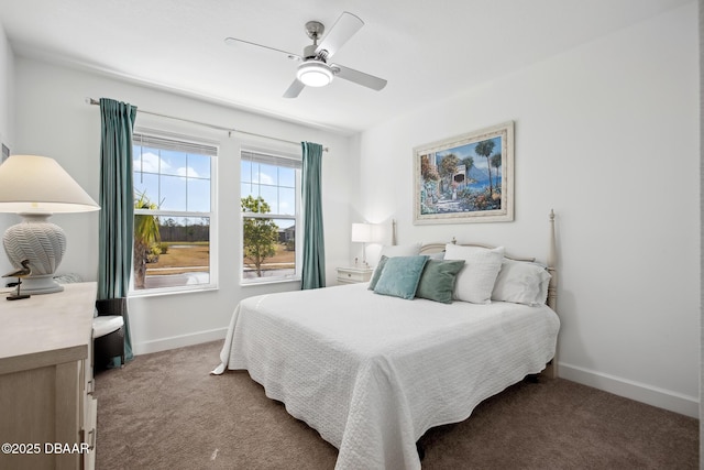 bedroom featuring ceiling fan and carpet