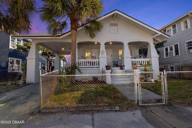 view of front of house featuring a yard and covered porch