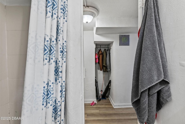 walk in closet featuring hardwood / wood-style flooring