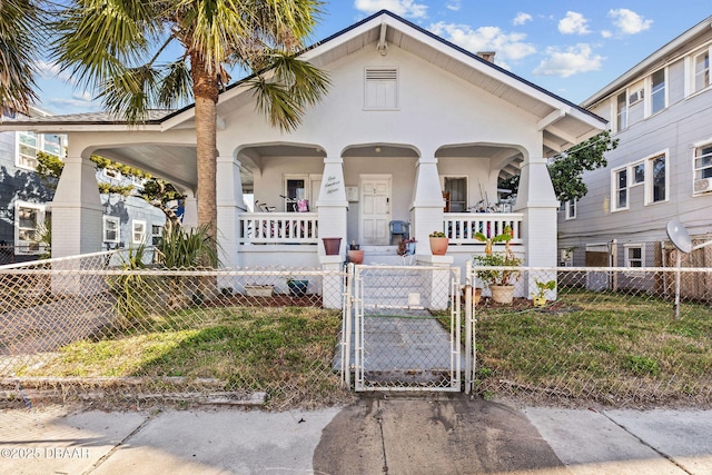 view of front of home with a front lawn and a porch