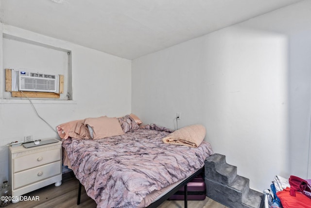 bedroom featuring hardwood / wood-style flooring