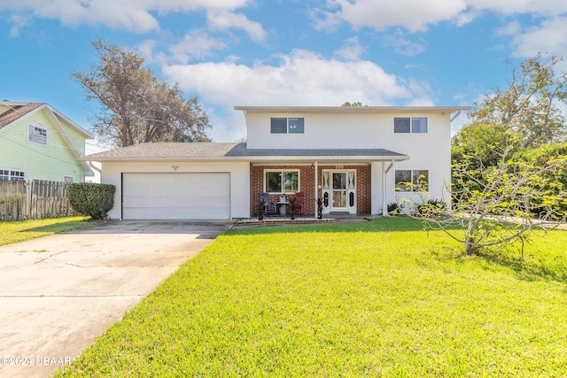 view of front property with a front yard, a porch, and a garage