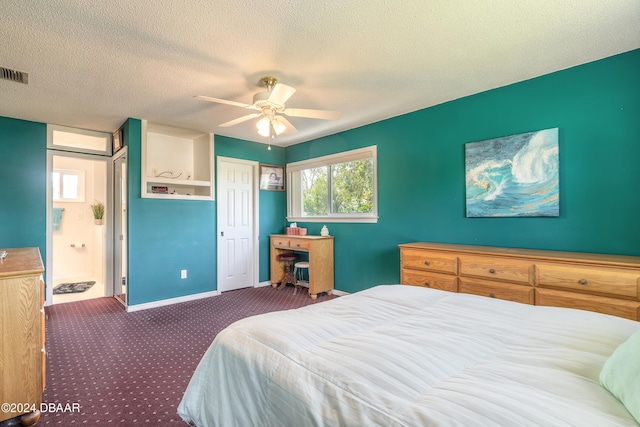 bedroom with dark colored carpet, a textured ceiling, and ceiling fan