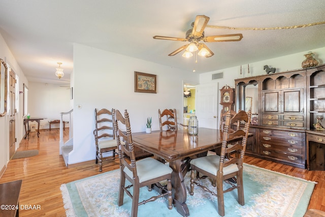 dining space featuring ceiling fan and light hardwood / wood-style flooring