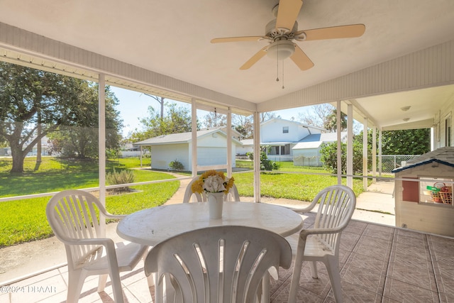 view of patio / terrace featuring an outbuilding, a garage, and ceiling fan