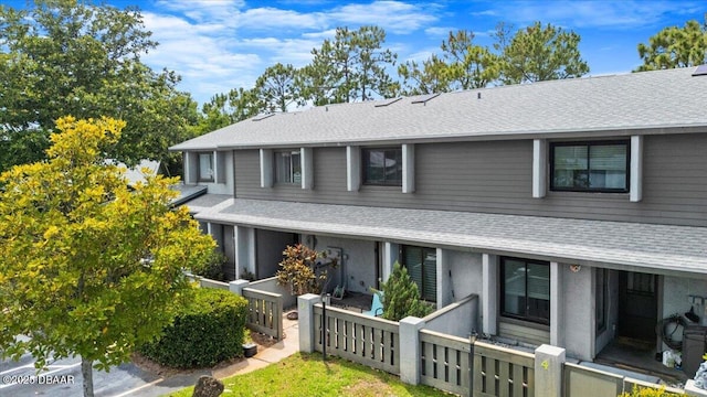 140 Limewood Pl Unit 3, Ormond Beach, FL 32174 - view of front of home featuring roof with shingles