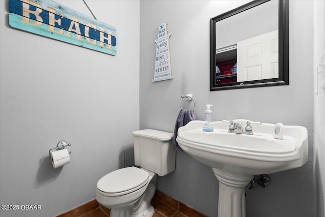 140 Limewood Pl Unit 3, Ormond Beach, FL 32174 - half bathroom with toilet, tile patterned flooring, and baseboards