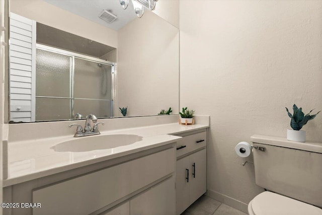140 Limewood Pl Unit 3, Ormond Beach, FL 32174 - bathroom featuring vanity, toilet, a stall shower, and tile patterned flooring