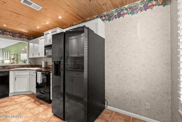 140 Limewood Pl Unit 3, Ormond Beach, FL 32174 - kitchen featuring black appliances, wood ceiling, white cabinets, dark countertops, and light tile patterned flooring