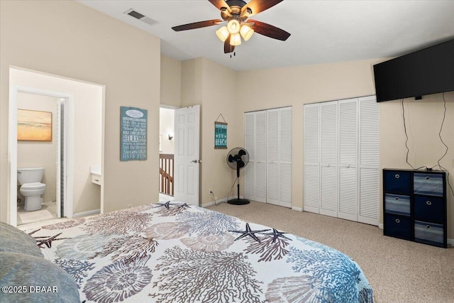 140 Limewood Pl Unit 3, Ormond Beach, FL 32174 - carpeted bedroom featuring multiple closets, ensuite bath, lofted ceiling, ceiling fan, and baseboards