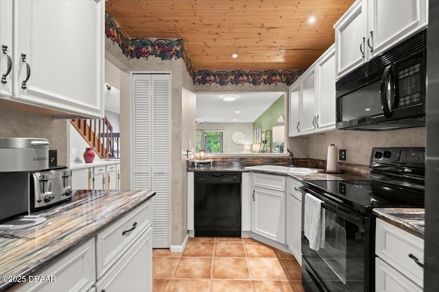 140 Limewood Pl Unit 3, Ormond Beach, FL 32174 - kitchen with black appliances, a sink, white cabinetry, wood ceiling, and light tile patterned floors