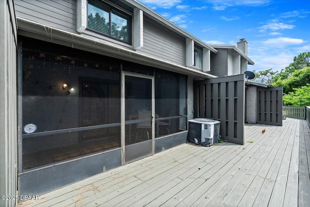 140 Limewood Pl Unit 3, Ormond Beach, FL 32174 - wooden deck featuring central air condition unit and a sunroom