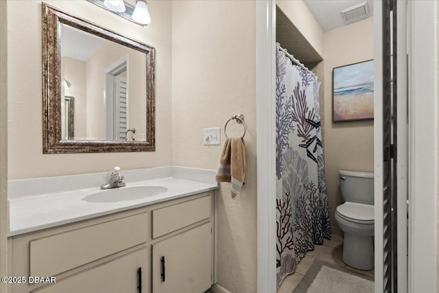 140 Limewood Pl Unit 3, Ormond Beach, FL 32174 - bathroom featuring toilet, vanity, a textured wall, tile patterned flooring, and a shower with shower curtain