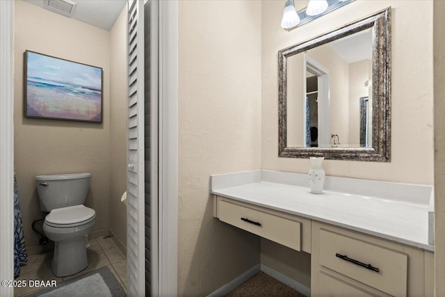 140 Limewood Pl Unit 3, Ormond Beach, FL 32174 - bathroom featuring toilet, vanity, and baseboards