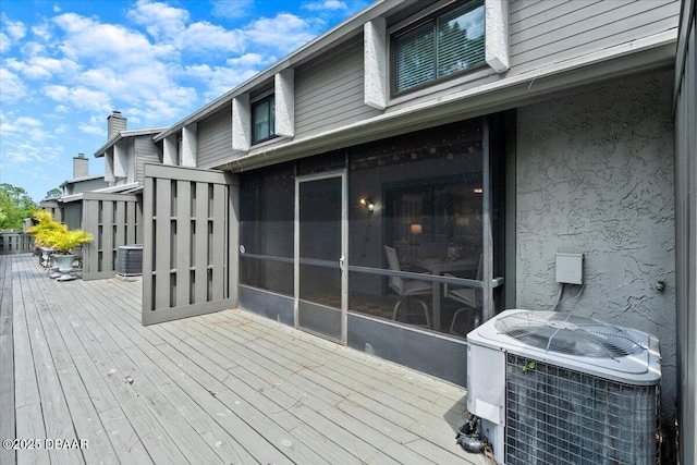 140 Limewood Pl Unit 3, Ormond Beach, FL 32174 - deck featuring central AC and a sunroom