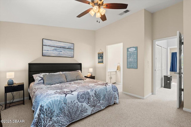 140 Limewood Pl Unit 3, Ormond Beach, FL 32174 - bedroom featuring carpet floors, baseboards, ceiling fan, and connected bathroom