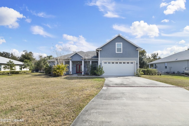 view of property with a garage and a front lawn