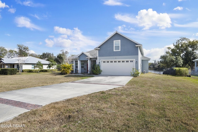 front of property featuring a garage and a front lawn