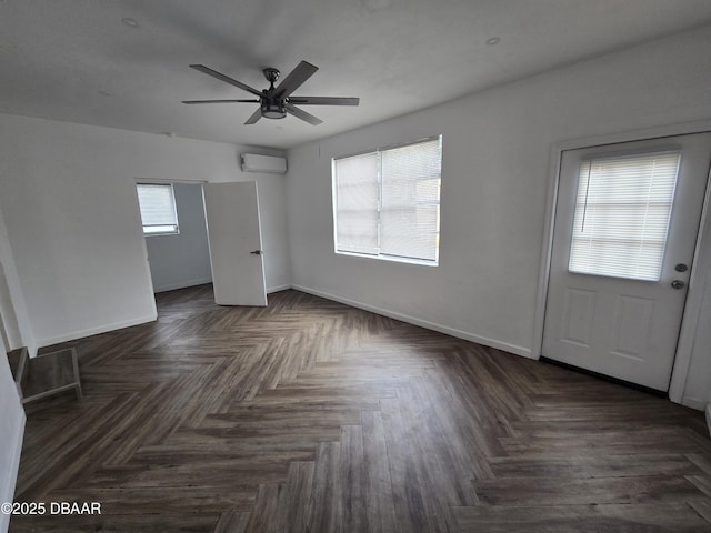 interior space featuring ceiling fan, a wall mounted air conditioner, and dark parquet floors