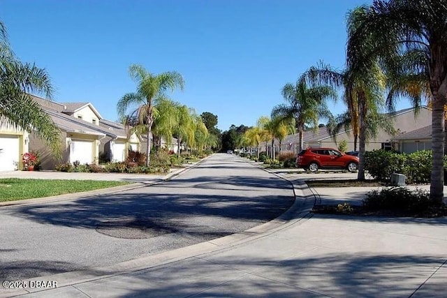 view of road with curbs and a residential view