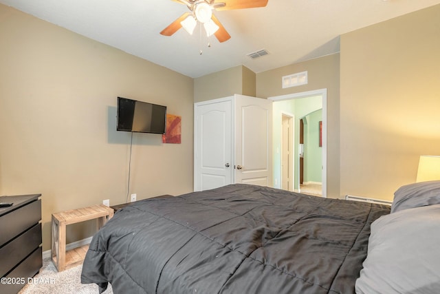 bedroom with visible vents, baseboards, ceiling fan, and a baseboard radiator