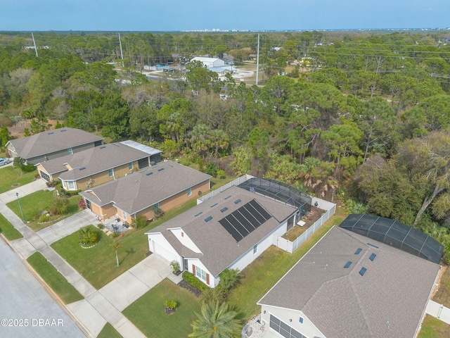 aerial view with a forest view and a residential view