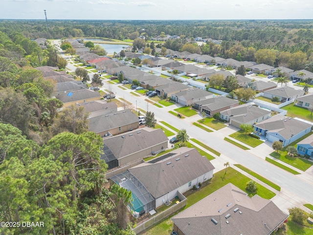 birds eye view of property with a residential view and a water view