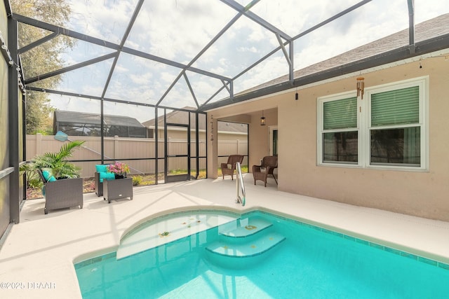 view of swimming pool featuring glass enclosure, a patio, fence, and a fenced in pool