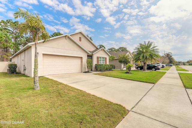 view of front of house featuring a front lawn, an attached garage, driveway, and stucco siding