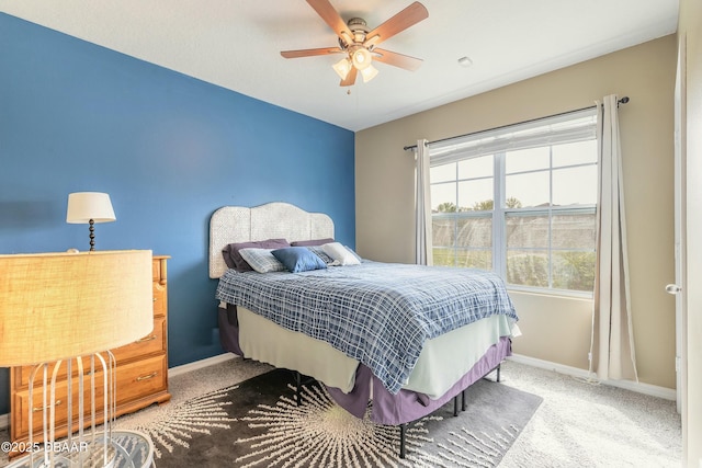 bedroom featuring carpet flooring, a ceiling fan, and baseboards