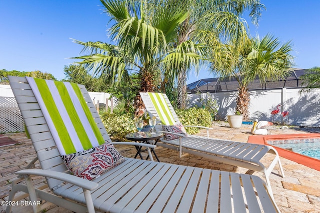 view of patio / terrace with a fenced in pool