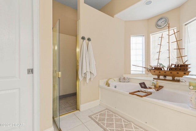 bathroom with tile patterned flooring and plus walk in shower