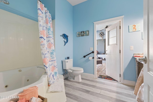 bathroom featuring hardwood / wood-style floors and toilet