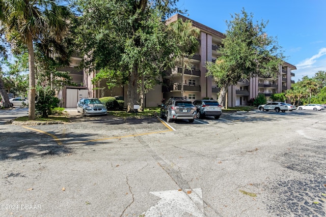 640 N Nova Rd Unit 104, Ormond Beach, FL 32174 - view of property with uncovered parking