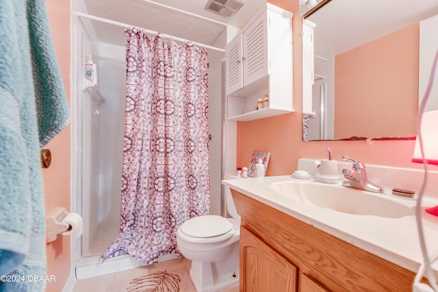 bathroom with tile patterned floors, vanity, toilet, and a shower with curtain