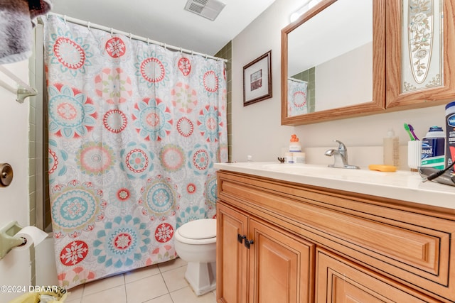 bathroom with toilet, vanity, tile patterned floors, and a shower with shower curtain