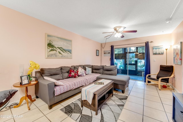 640 N Nova Rd Unit 104, Ormond Beach, FL 32174 - living area with ceiling fan, light tile patterned flooring, and a textured ceiling