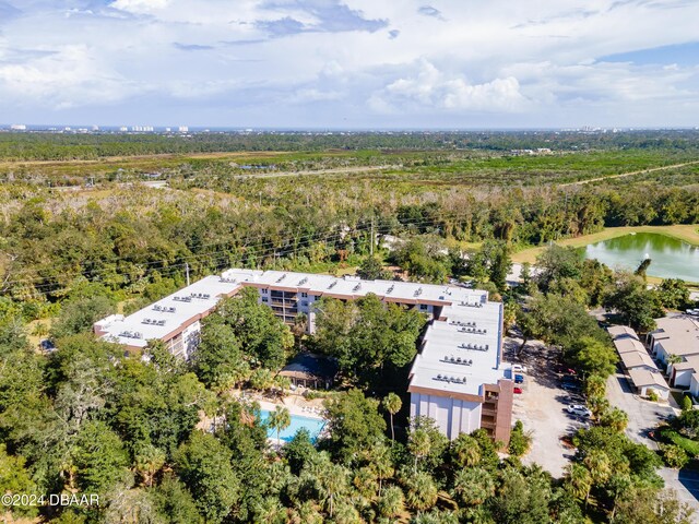 640 N Nova Rd Unit 104, Ormond Beach, FL 32174 - bird's eye view of a heavily wooded area and a nearby body of water