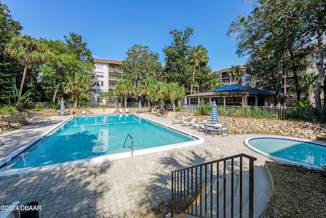640 N Nova Rd Unit 104, Ormond Beach, FL 32174 - community pool with a patio area