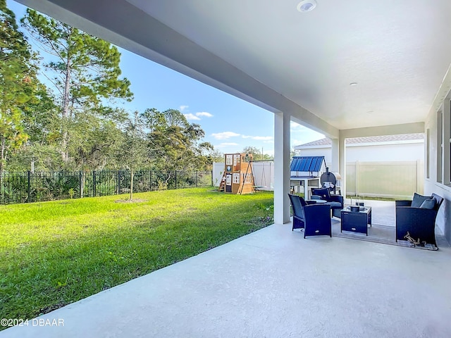 view of patio with an outdoor hangout area and a playground