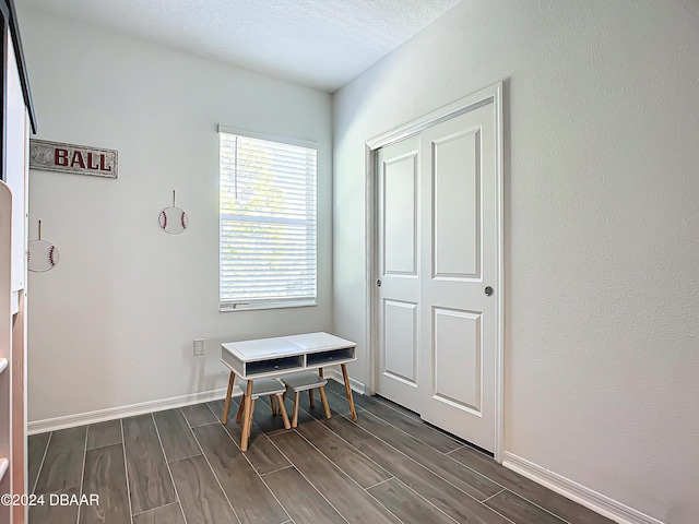 interior space with a textured ceiling